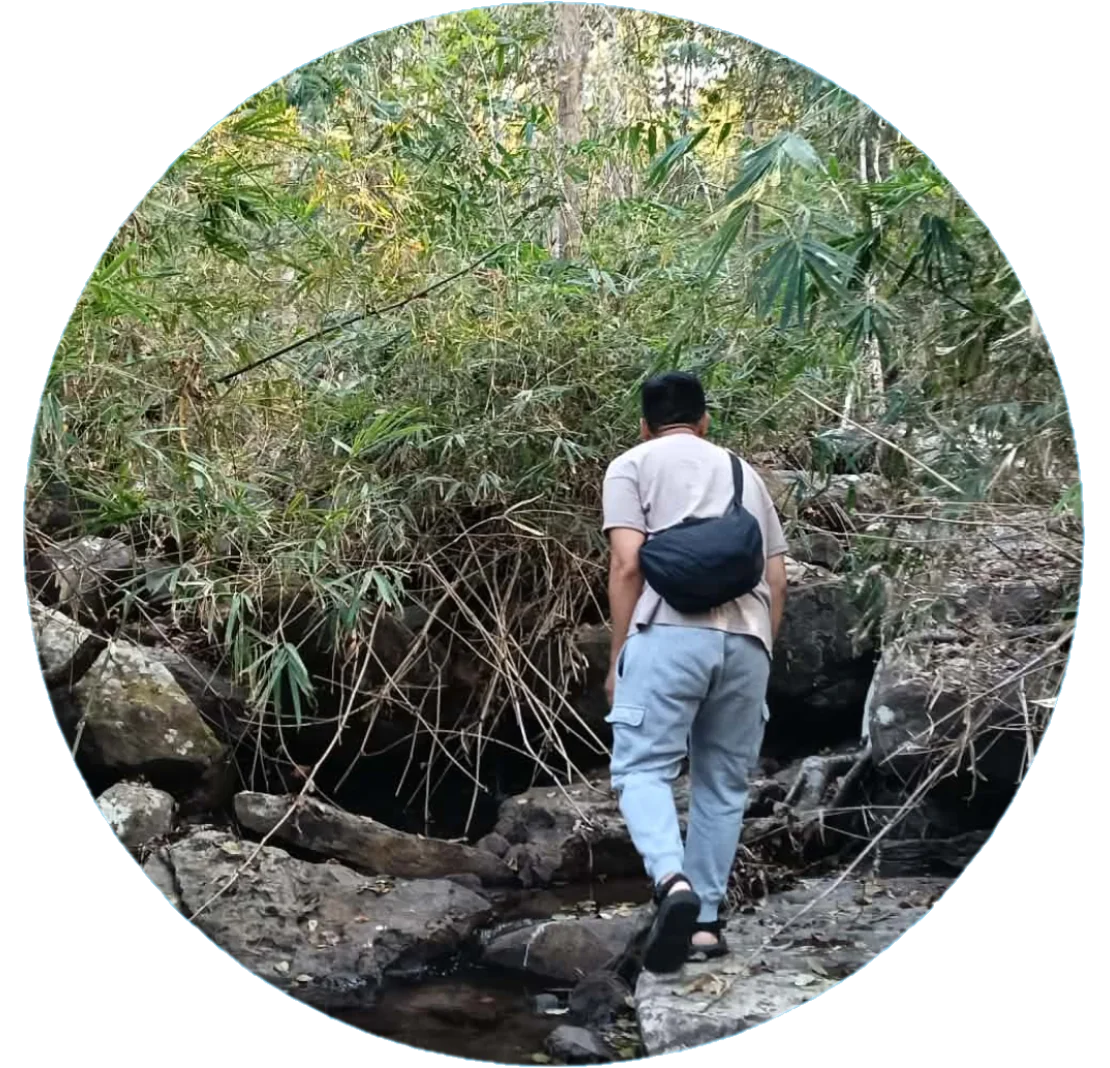 Isyah, walking toward a forest stream
